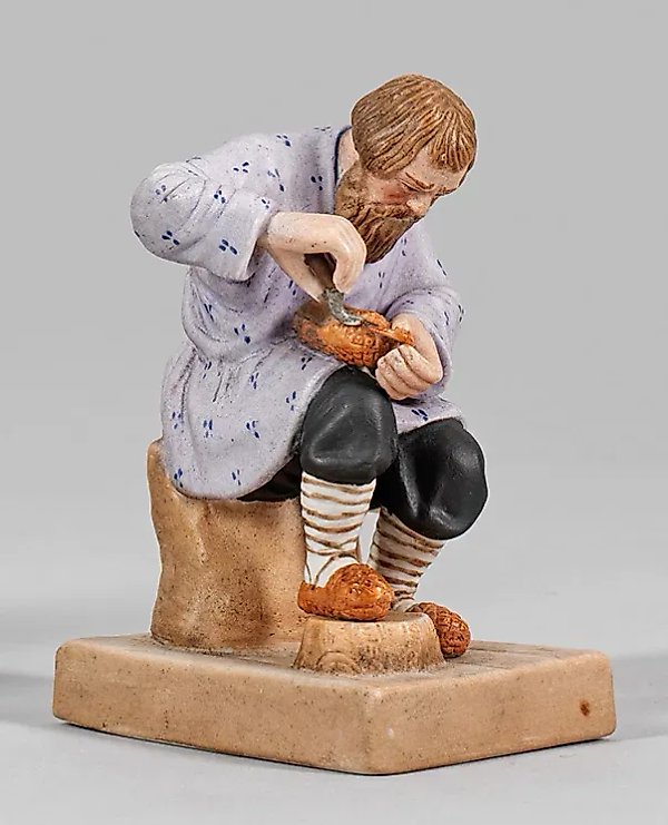 Porcelain Russian shoemaker with carved footwear
