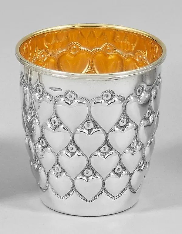 Silver goblet with hearts.