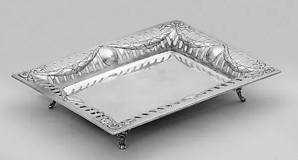 A small and decorative silver stand