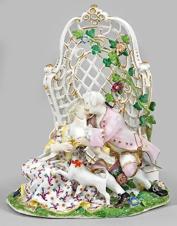 Porcelain figurine group of a pair of lovers with a pug