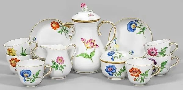 Coffee set with floral decoration.