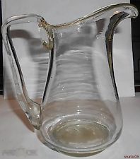 An old, beautiful milk jug