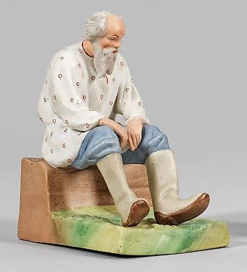 Русский крестьянин из бисквитного фарфора на натуральном основании