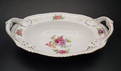 Porcelain bowl Kuznetsov Latvija - 125th anniversary of the company, with handles and pattern, has a crack in the glaze.