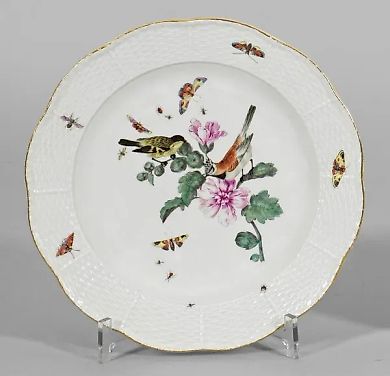 Decorative plate with images of a bird and insects