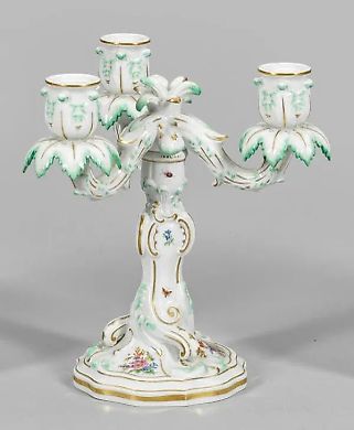 Table candlestick with floral decoration.
