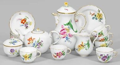 A 16-piece porcelain dinnerware set with a floral pattern for six people