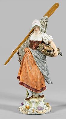 Porcelain figurine of a fisherwoman with an oar and a fish.