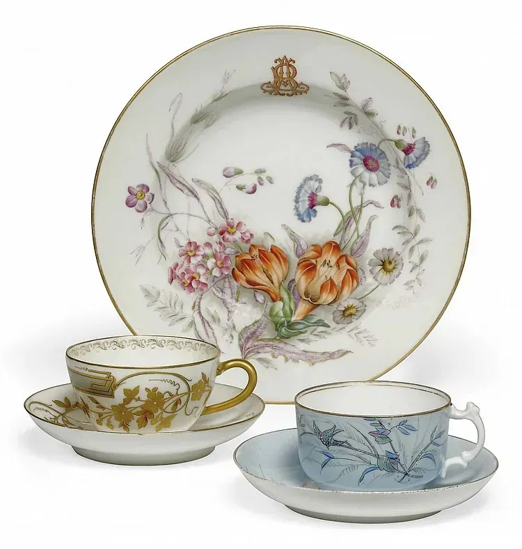 A RUSSIAN PORCELAIN SOUP-PLATE AND TWO CUPS AND SAUCERS