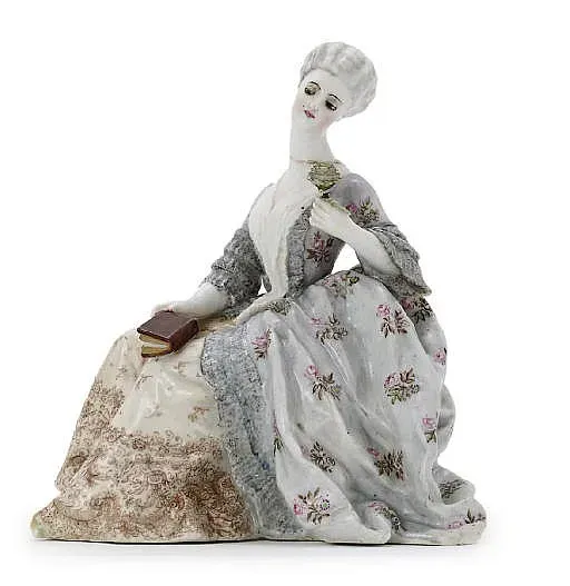 A porcelain figure of a Lady with a rose