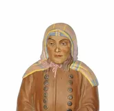 A RUSSIAN BISCUIT PORCELAIN FIGURE OF A SIBERIAN PEASANT