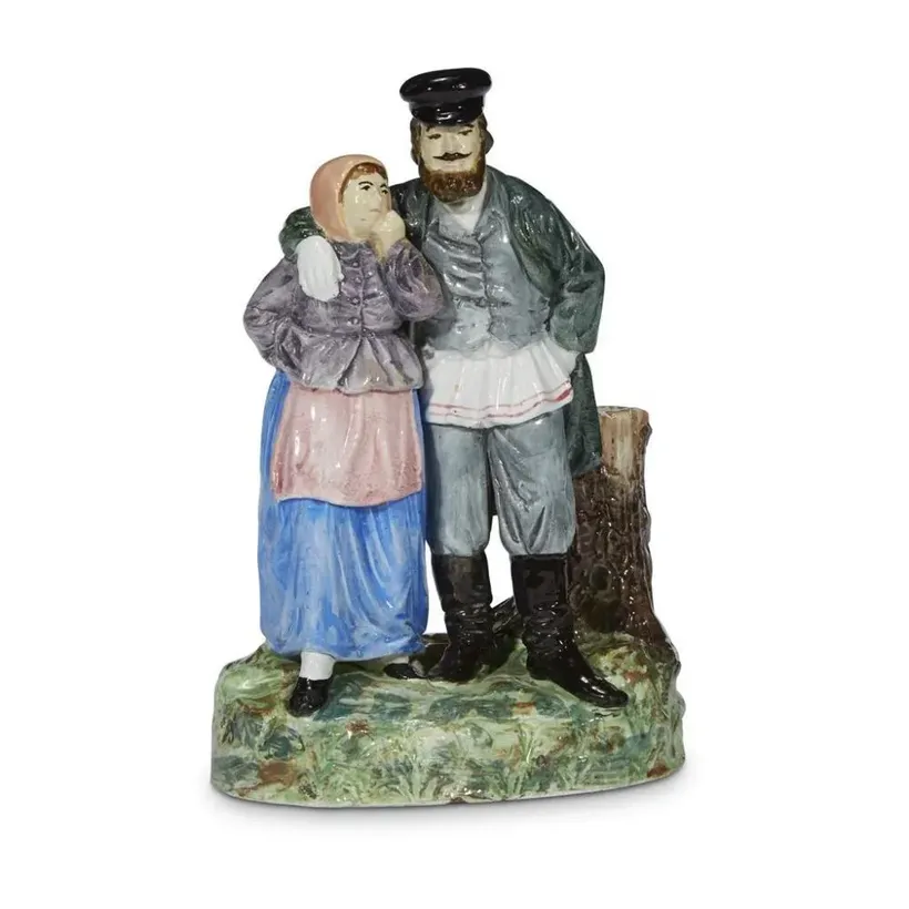 A Russian porcelain group "Peasant Couple", M.S. Kuznetsov Manufactory, Tver, 1889-1917