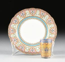 AN IMPERIAL RUSSIAN PORCELAIN PLATE AND AN IMPERIAL GERMAN ENAMELED SCHNAPPS GLASS, LATE 19TH