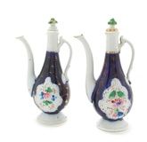 A Pair of Russian Porcelain Ewers, Kuznetsov,each with a shaped green stopper, the bodies with
