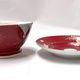 Комплект фарфоровой посуды Кузнецова с узором виноградной лозы.