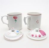 Two near pairs of Russian hand decorated porcelain mugs and covers