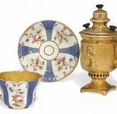 A RUSSIAN PORCELAIN SUGAR-BOWL AND A CUP AND SAUCER