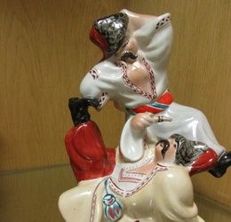 A Kiev Experimental porcelain group of two cossacks dancing, 23cm high