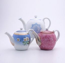Three Russian Porcelain Teapots Three Russian Porcelain Teapots. Each of bullet form; the largest by