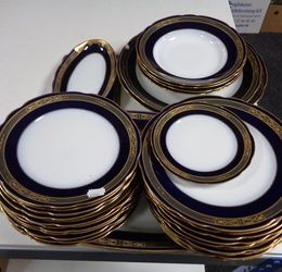 Thirty pieces of Russian Kuznetsov blue and white gilded porcelain dinner ware