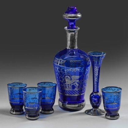 Liqueur residue service and vase with silver overlay.