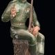 SOVIET PORCELAIN FIGURINE OF VASSILII TERKIN AS A SEATED YOUNG SOLDIER, DESIGNED BY ALEKSEI GEORGIEVICH, DULEVO PORCELAIN FACTORY, 1948