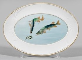 Art Nouveau plate with pike and frog motifs.