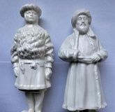 Two porcelain figurines depicting the people of Russia.