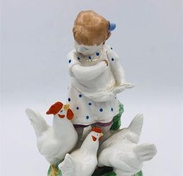 Porcelain Russian figure of a young girl feeding chickens by Dulevo - 1959