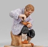 Russian wooden shoemaker biscuit porcelain. Sitting on a rectangular base, ...