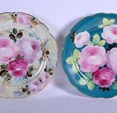 A PAIR OF SOVIET RUSSIAN PORCELAIN DULEVO DISHES painted with bold flowers. 34 cm wide.
