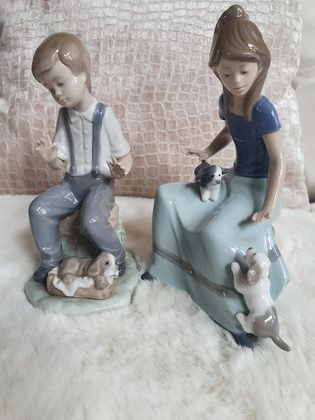 A girl with 2 puppies or a boy with a dog figurine. Excellent condition.