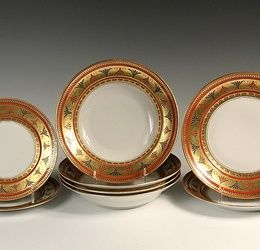 (8 PCS) RUSSIAN PORCELAIN - Dulevo Porcelain, Moscow, circa 1930s export porcelain in the Ambassador pattern, with orange, black and gilt decoration, including: (4) 9 1/4" soup plates; (2) 9 1/4" dinner plates and (2)...