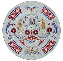 AN ANTIQUE RUSSIAN FAIENCE CHARGER BY KUZNETSOV