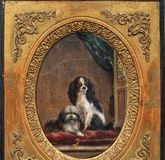 "A rare image of a dog in an interior: King Charles Spaniel and Bolognese in a small oval painting"