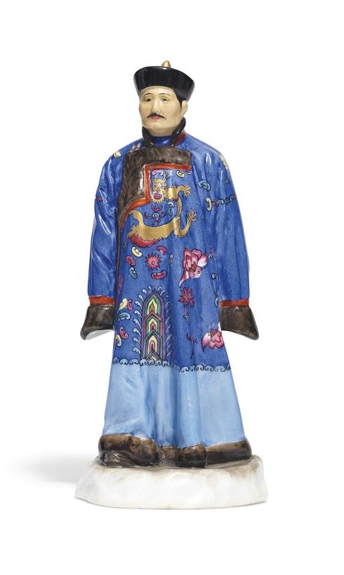 A PORCELAIN FIGURE OF A BURYAT MAN FROM THE ‘PEOPLES OF RUSSIA’ SERIES
