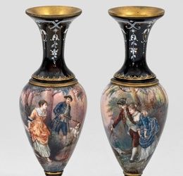 A pair of decorative ornamental vases with gallant couples.