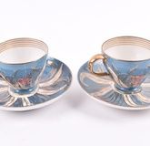 A pair of Imperial Russian Kuznetsov porcelain cups and saucers circa 1891-1917, the cups with