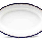 A Russian Porcelain Platter, Kuznetsov,of oval form with a gilt and navy border, signed.Width 21