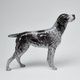 The figurine of a hunting dog.