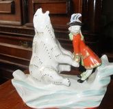 Porcelain figurine of Baron Munchausen and the White Bear of the USSR.
