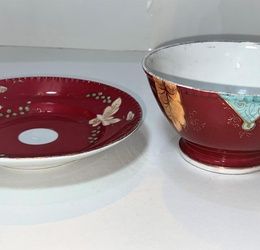A Kuznetsov porcelain bowl and dish, pink ground with vine decoration, red marks to base