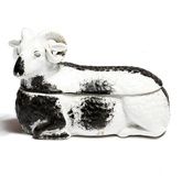 A late 19th century Russian Kuznetsov porcelain box and cover, in the form of a recumbent ram,