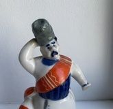 The figurine "Matchmaker" from the triptych "Natalka Poltavka" based on the play by I. P. Kotlyarevsky.