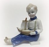 Boy with a little ship.
