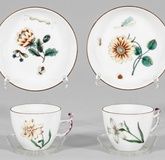 Pair of decorated cups with woodcut flowers