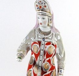 A Russian porcelain figurine Mistress of the Mine By Dulevo, printed marks to base, height 33cm