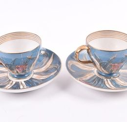 A pair of Imperial Russian Kuznetsov porcelain cups and saucers circa 1891-1917, the cups with