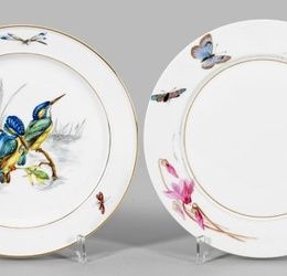 Two decorative plates with floral and kingfisher decor.