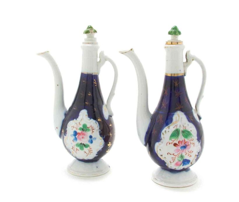 A Pair of Russian Porcelain Ewers, Kuznetsov,each with a shaped green stopper, the bodies with